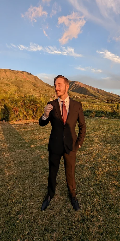 A picture of Jacob dressed up on a hillside